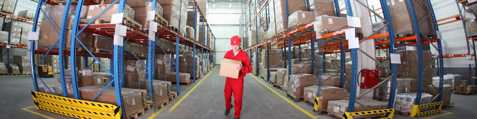 man holding a box in a warehouse